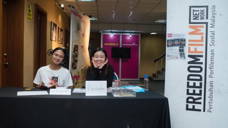 Natalie (right) at the handling the registration of a film screening